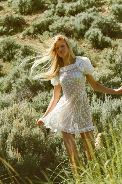 Photo of Hamptons Eyelet Mini Dress in White on model, view 1