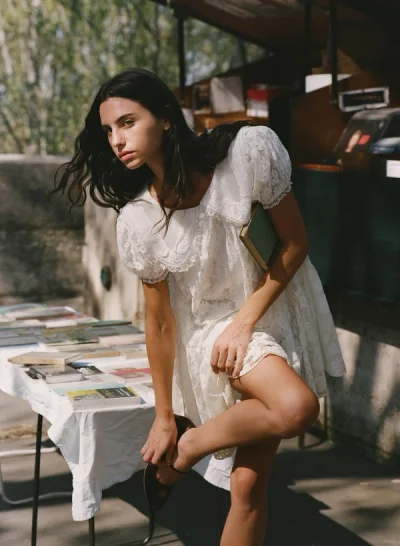 Photo of Ditsy Petal Babydoll Mini Dress in White on model, view 1