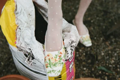 Photo of Elodie Floral Beaded Mule in Ivory on model, view 1
