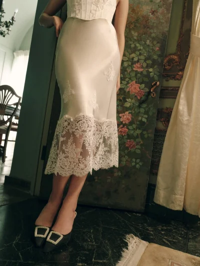 Photo of Rose Midi Skirt in Ivory on model, view 1