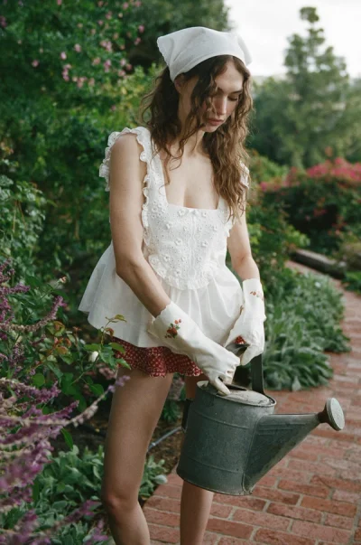 Photo of Laura Eyelet Top in White on model, view 1